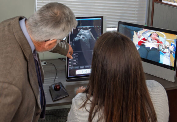 VHH Robotic Ultrasound Technologist Martine Pringle demonstrates the capabilities of robotic ultrasound technology to examine a patient at a distance.